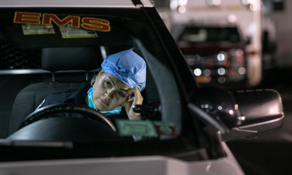 Paramedic Patricia Rodriguez fills out reports on a laptop after her 12-hour shift in Yonkers, New York, on 6 April.