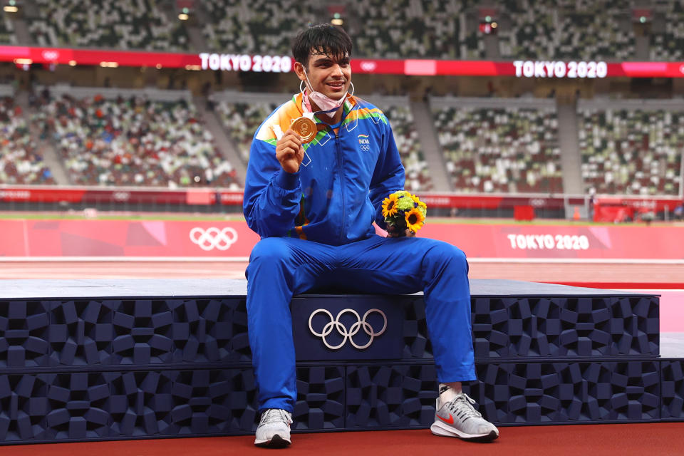 Tokyo 2020 Olympics - Athletics - Men's Javelin Throw - Medal Ceremony - Olympic Stadium, Tokyo, Japan - August 7, 2021. Gold medallist Neeraj Chopra of India reacts on the podium REUTERS/Andrew Boyers