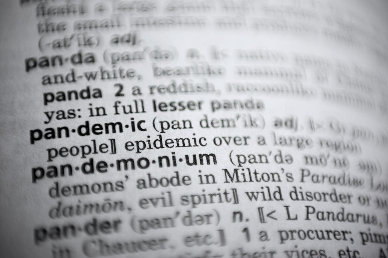 In this Saturday, Nov. 21, 2020, photo the word pandemic is displayed in a dictionary in Washington. Merriam-Webster on Monday announced “pandemic” as its 2020 word of the year. (AP Photo/Jenny Kane)