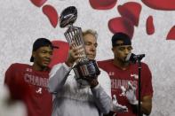 Alabama head coach Nick Saban holds up the trophy after their 31-14 win over Notre Dame in the Rose Bowl NCAA college football game in Arlington, Texas, Friday, Jan. 1, 2021. (AP Photo/Michael Ainsworth)