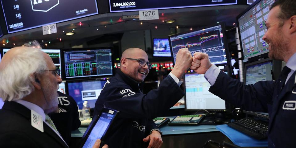 traders happy celebrate fist pound
