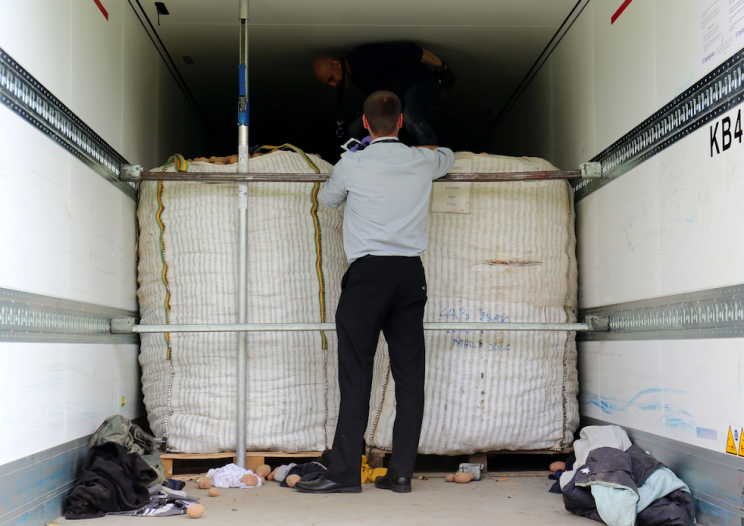 Lorry drivers are fined if migrants are fund stowing away on board their vehicles (PA)