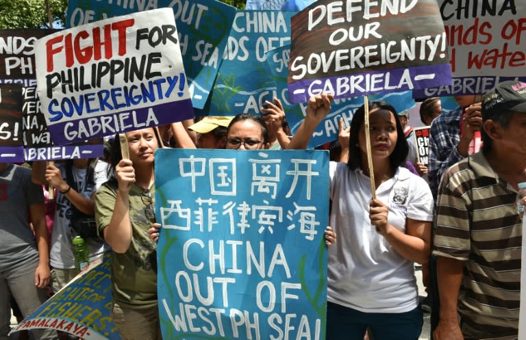 Activists protest outside the Chinese consulate in Manila ahead of a UN tribunal ruling on the legality of China's claims to an area of the South China Sea contested by the Philippines