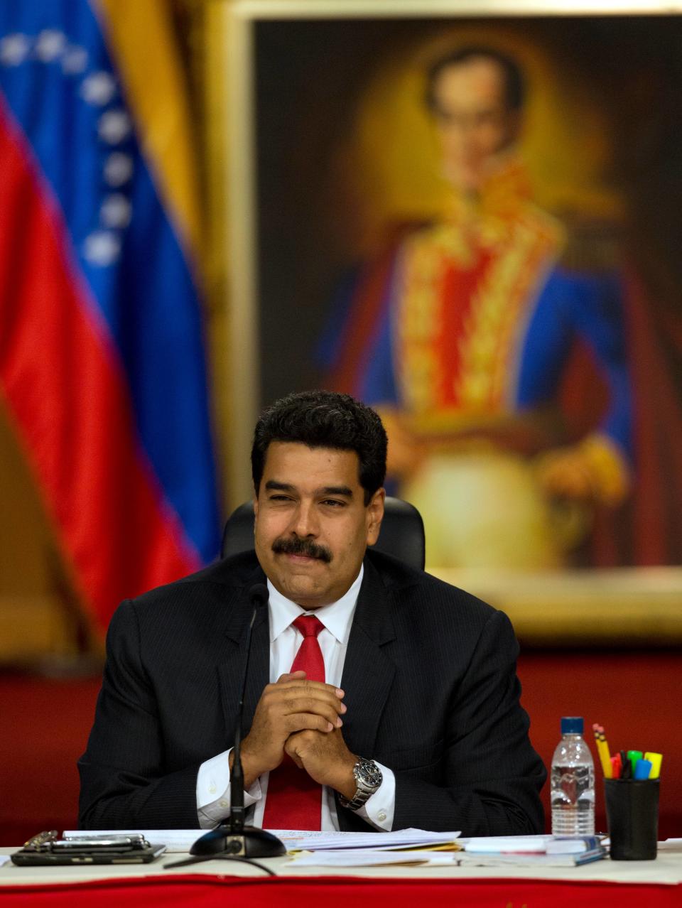 Venezuela's President Nicolas Maduro attends the start of a meeting with key members of the opposition at Miraflores presidential palace in Caracas, Venezuela, Thursday, April 10, 2014. The Vatican is sponsoring the first talks aimed at reconciliation since protests began in early February. Maduro's opponents blame his government for destroying the oil-rich economy and stamping out dissent, while Maduro claims he's the target of U.S.-backed coup attempt. (AP Photo/Fernando Llano)