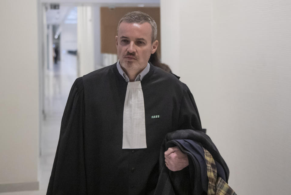 Emmanuel Pierrat lawyer of French writer Gabriel Matzneff, who is accused of child sexual abuse arrives at Paris' court house, Wednesday, Feb. 12, 2020. The legal woes of 83-year-old once celebrated writer, Gabriel Matzneff, are mounting, with a police investigation opened for rape of minors and a new case brought by an NGO for actively promoting pedophilia in recent articles in which he defended an affair decades ago with an underaged girl. (AP Photo/Michel Euler)