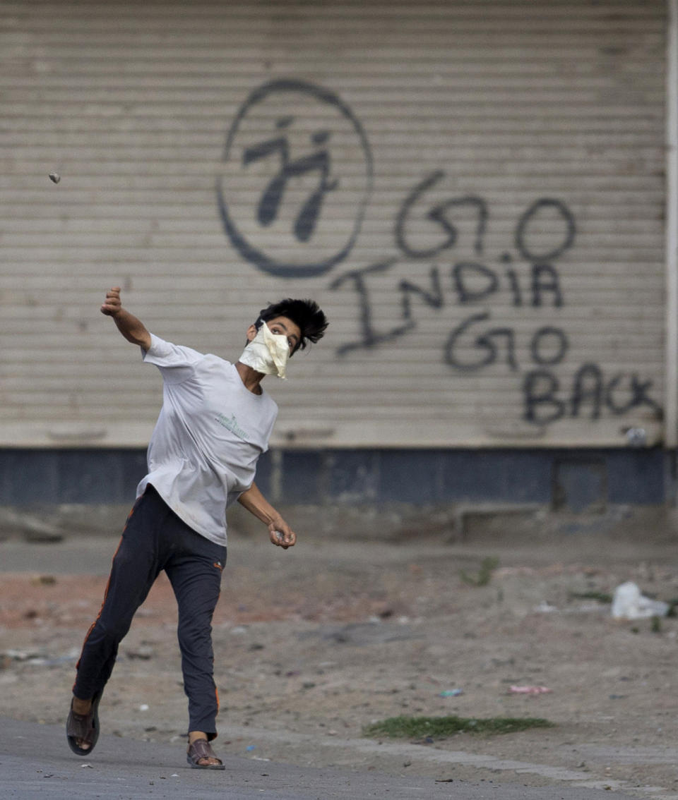 Protester throws stone