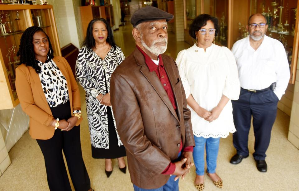 (Left to right) Booker T Washington Principal Crystal Tate Barnes, alumni Sharon Johnson, Calvin Austin, City Councilwomen Tabatha Taylor, and Judge Leon Emanuel (photographed on March 18, 2022) stand in appreciation of the city of Shreveport resolution that apologies for the 1963 police attacks at BTW high school.  