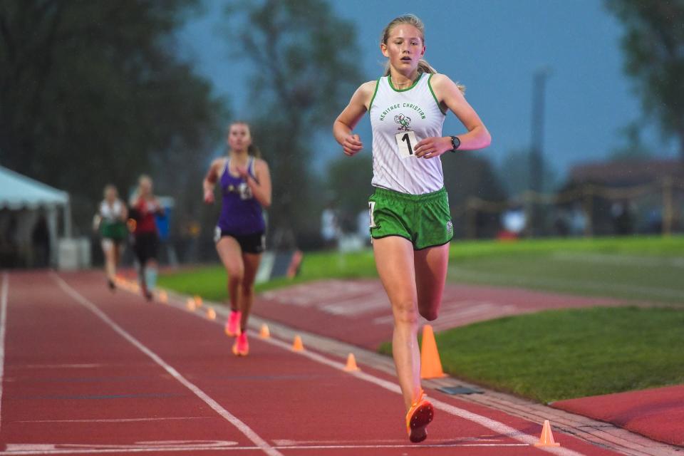 Heritage Christian's Mikaela Kendall crosses the finish line during the Class 2A girls 3,200-meter race at the Colorado high school track and field state meet at Jeffco Stadium on Thursday, May 18, 2023, in Lakewood, Colo. Kendall placed first.