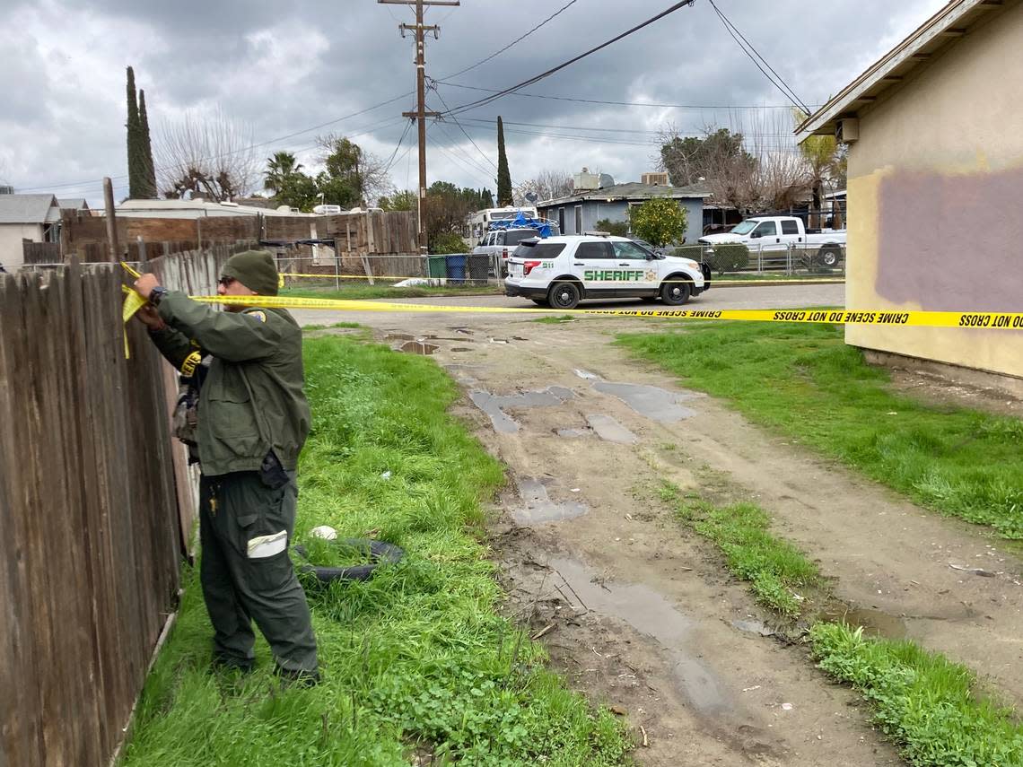 Tulare County Sheriff’s deputies continued to investigate the home Tuesday, Jan. 17, 2023, where six people were killed the previous day in a potential drug cartel massacre. LEWIS GRISWOLD/Special to The Bee