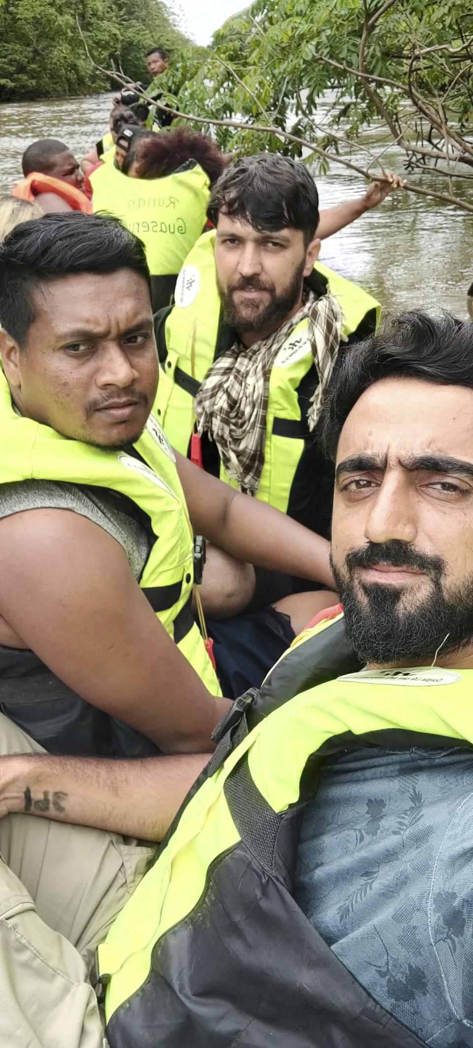 In this photograph provided by Sami-ullah Safi, Abdul Wasi Safi, bottom right, takes selfie near the Darien Gap, a stretch of land that separates Colombia and Panama, in the summer of 2022, during his journey to the U.S in 2022. Safi's brother, who's called Wasi by his family, was an intelligence officer with the Afghan National Security Forces, providing U.S. armed forces with information for operations against terrorists, said Sami-ullah Safi. Wasi was arrested after crossing the U.S.-Mexico border near Eagle Pass, Texas in September 2022, and charged with a federal misdemeanor related to wrongly entering the country and placed in a detention center in Central Texas. (AP Photo/Abdul Wasi Safi)