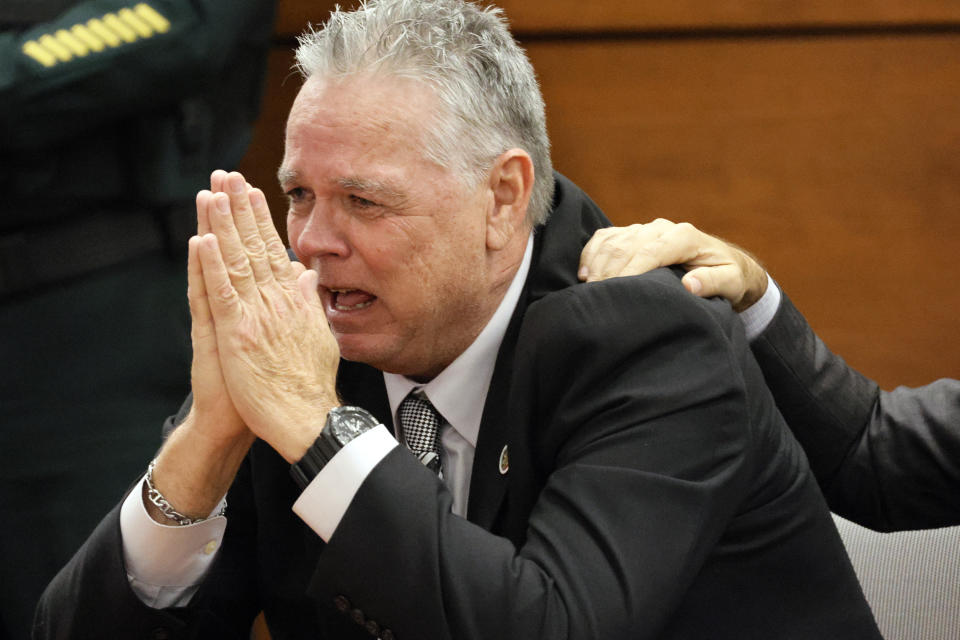 Former Marjory Stoneman Douglas High School School Resource Officer Scot Peterson reacts as he is found not guilty on all charges at the Broward County Courthouse in Fort Lauderdale, Fla., on Thursday, June 29, 2023. Peterson was acquitted of child neglect and other charges for failing to act during the Parkland school massacre, where 14 students and three staff members were murdered. (Amy Beth Bennett/South Florida Sun-Sentinel via AP, Pool)