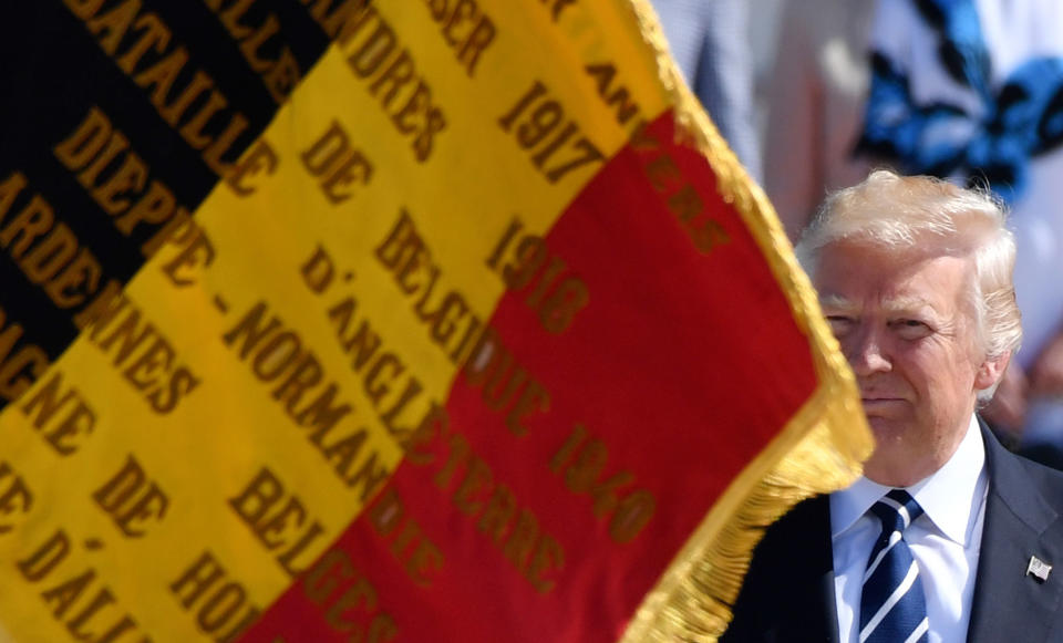 <p>A Belgian flag blows in front of President Donald Trump as he arrives at Melsbroek Military Airport in Melsbroek, Belgium on Wednesday, May 24, 2017. President Trump is in Belgium to attend a NATO summit and to meet EU and Belgian officials. (Photo: Geert Vanden Wijngaert/AP) </p>