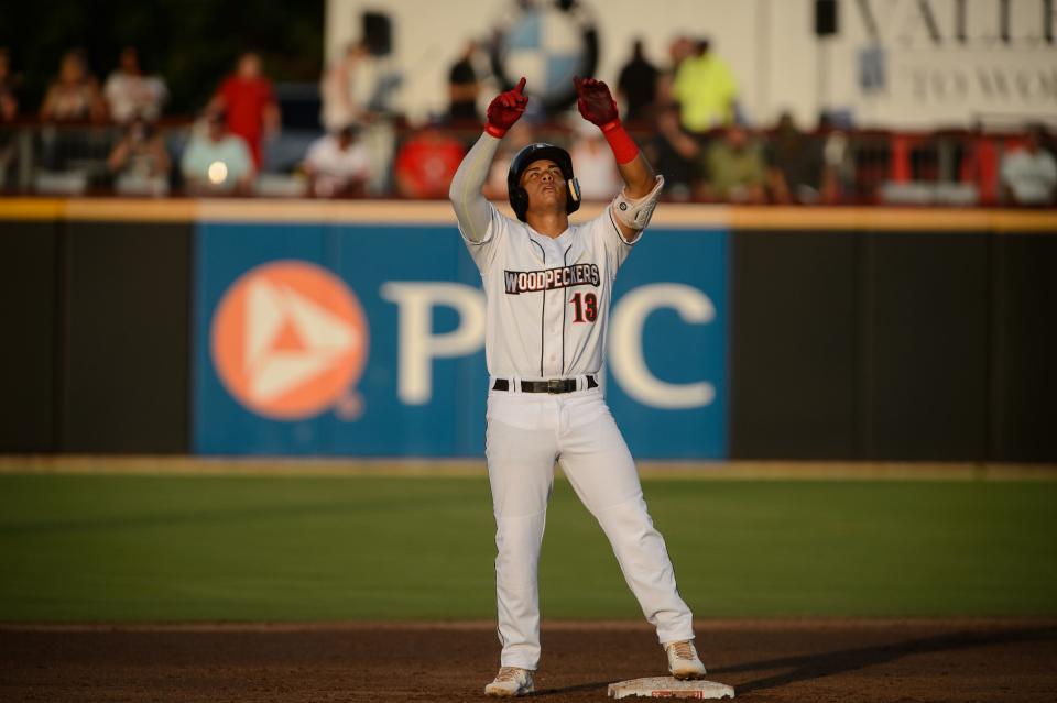 Fayetteville’s J.C. Correa points to the sky after making it to second base during a game against Carolina on Thursday, July 1, 2021, at Segra Stadium.