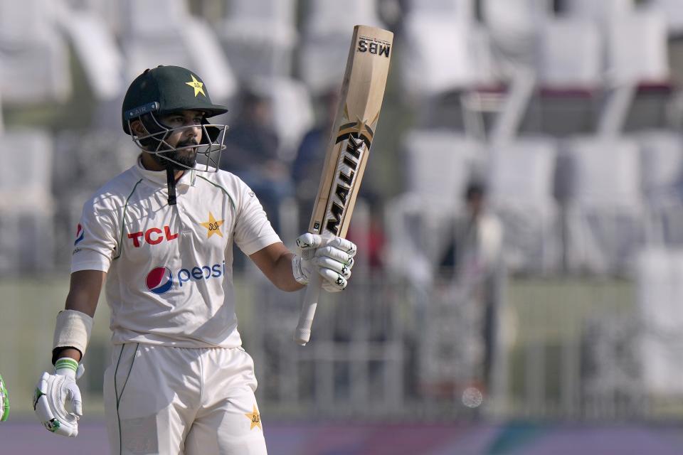 Pakistan Saud Shakeel celebrates after scoring fifty during the fifth day of the first test cricket match between Pakistan and England, in Rawalpindi, Pakistan, Monday, Dec. 5, 2022. (AP Photo/Anjum Naveed)