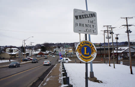 Road signs are posted at the entrance to a city nicknamed "Friendly City" which recently passed a city ordinance protecting LGBT people in Wheeling, West Virginia, February 10, 2017. REUTERS/Letitia Stein