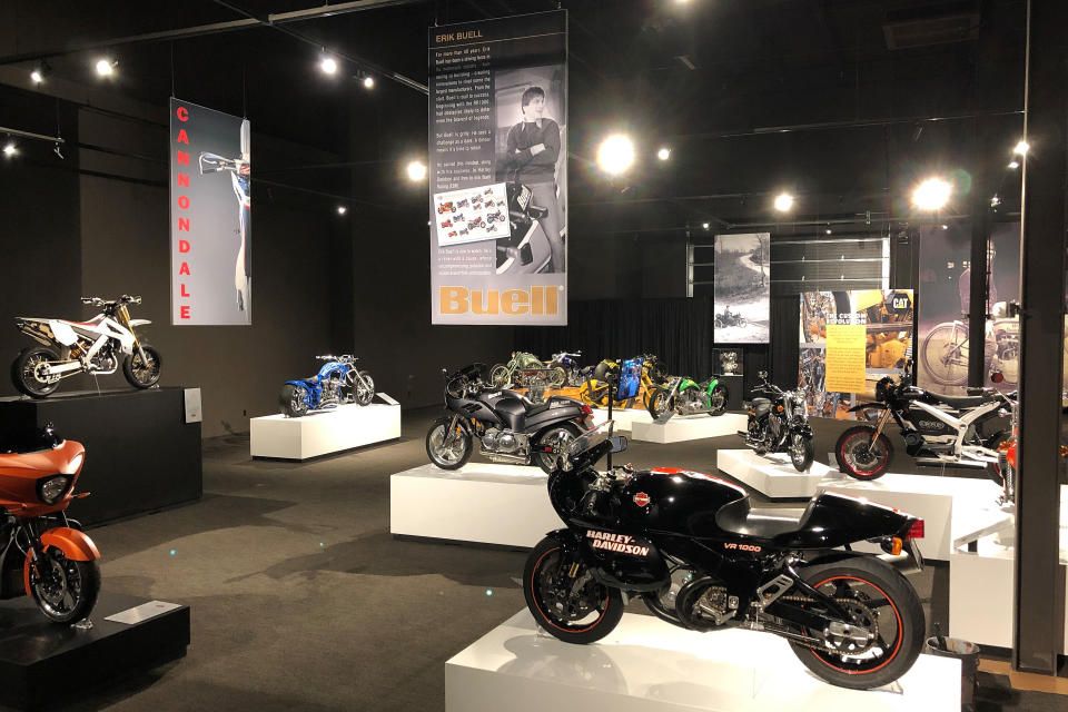 Motorcycles sit in an exhibition hall at the Graceland tourist attraction on Wednesday, May 22, 2019, in Memphis, Tenn. The collection of motorcycles spans decades and is one of three new exhibits set to open at Elvis Presley's Graceland. (AP Photo/Adrian Sainz)