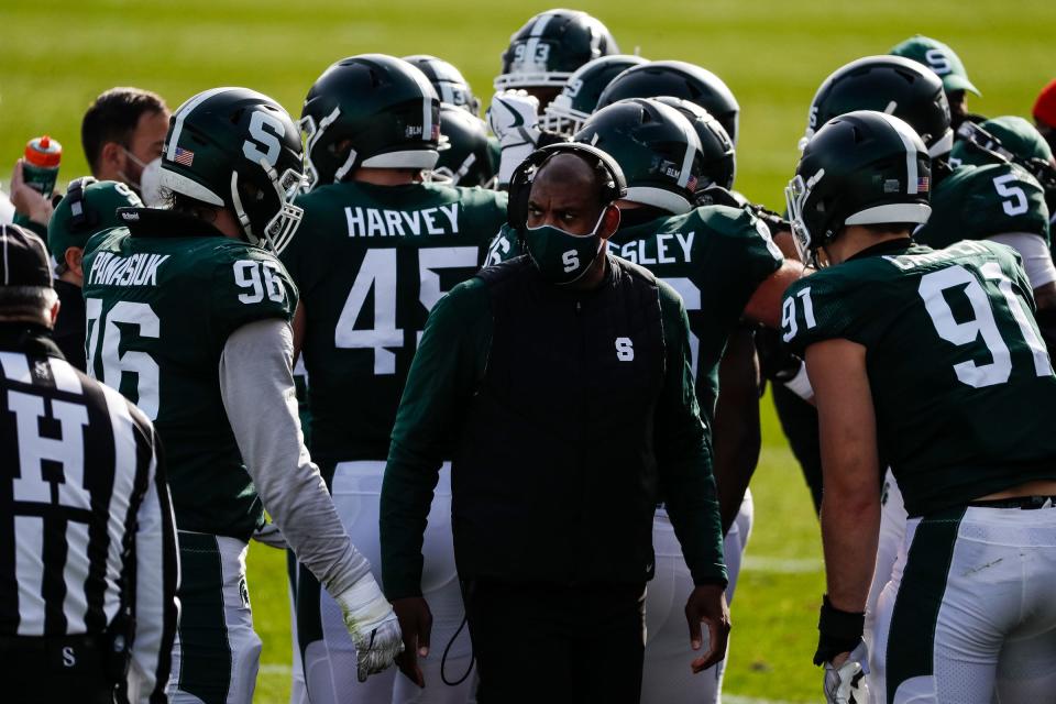 Michigan State coach Mel Tucker talks to players during a timeout during the first half against Indiana at Spartan Stadium in East Lansing, Saturday, Nov. 14, 2020.