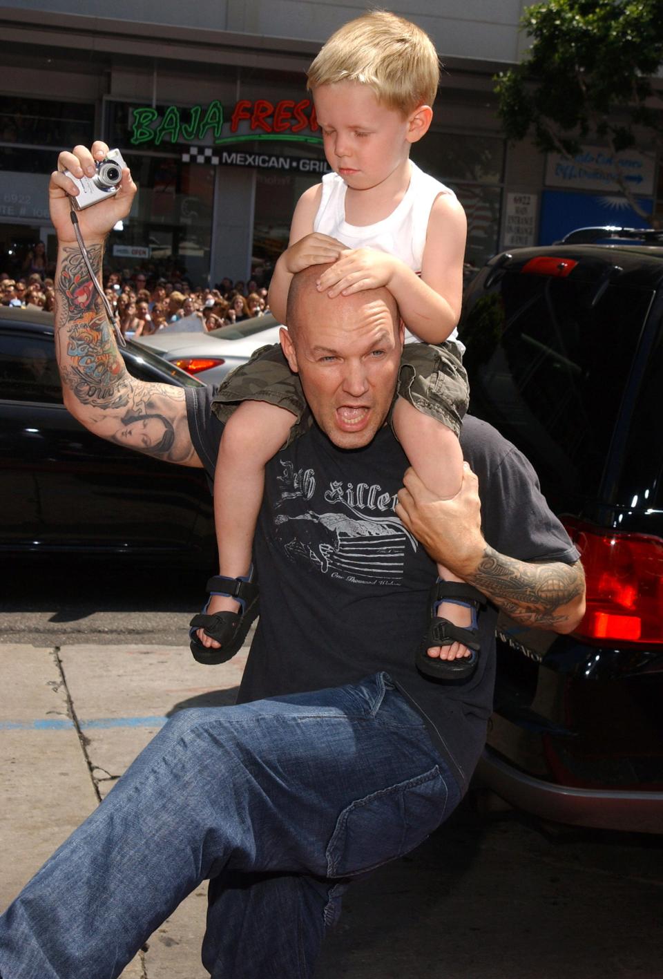Fred Durst with his son on his shoulders
