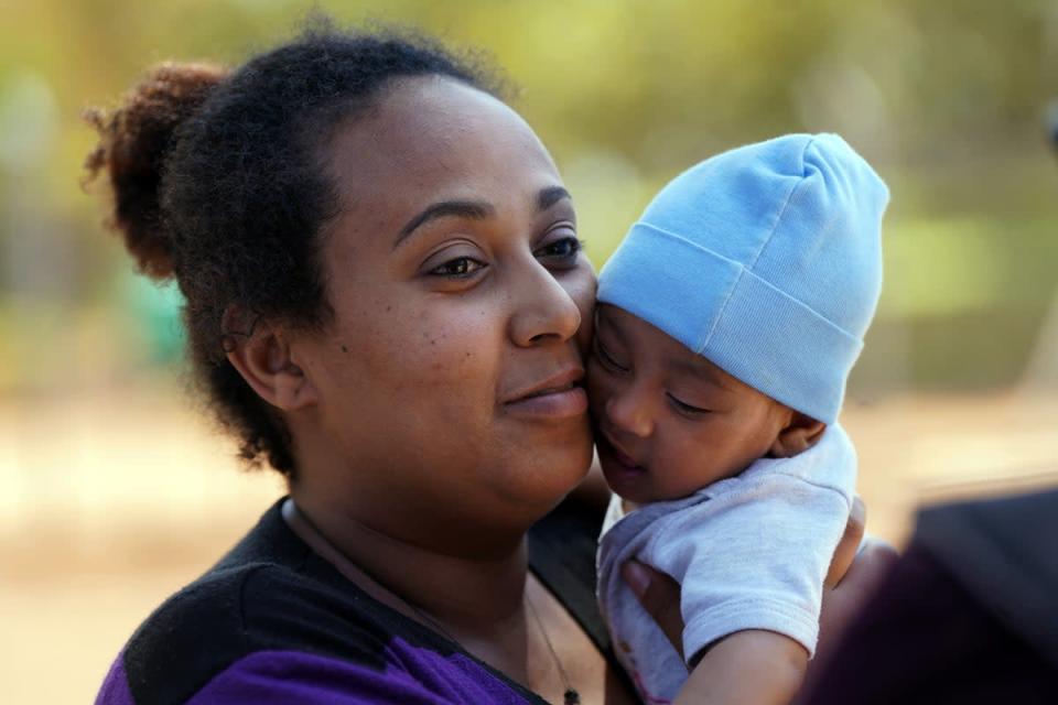 Resident Meseret Girmy, 24, and her three-month-old son Amin (Victoria Jones/PA) (PA Wire)