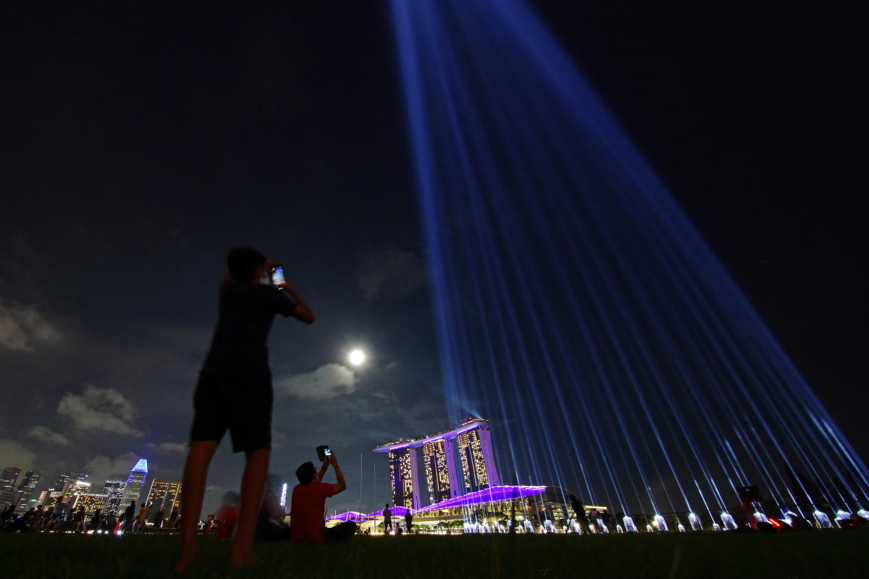 A light projection at the Marina Bay Sands in Singapore in place of fireworks for the New Year's Eve celebration.