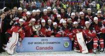 Team Canada poses for photographers after winning the Ice Hockey World Championship final game at the O2 arena in Prague, Czech Republic May 17, 2015. REUTERS/David W Cerny