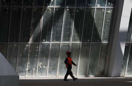 A construction worker walks at the construction site of Samara Arena stadium which will host matches of the 2018 FIFA World Cup in Samara, Russia August 23, 2017. REUTERS/Maxim Shemetov