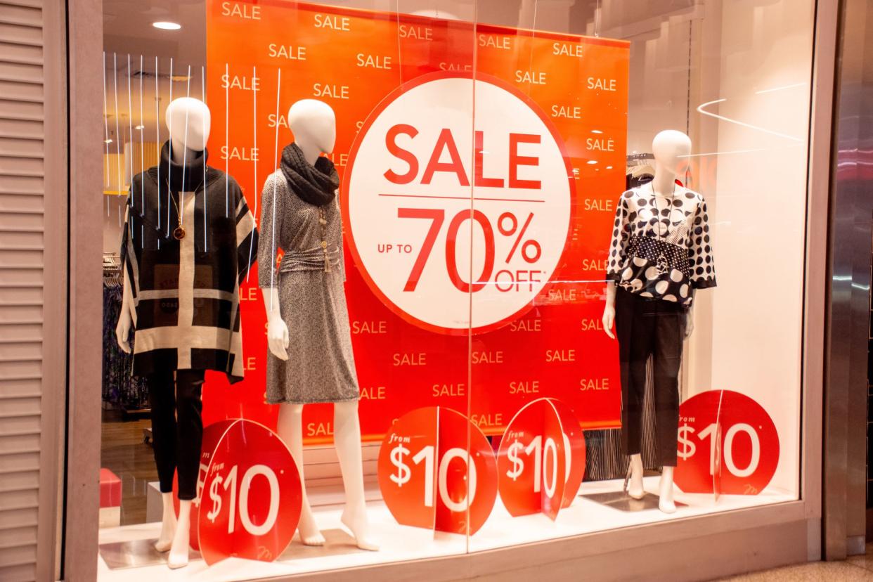 70% off sales promotion on retail shop display window.