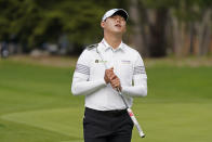 Si Woo Kim, of South Korea, reacts after missing a birdie putt on the sixth green of the Spyglass Hill Golf Course during the second round of the AT&T Pebble Beach Pro-Am golf tournament Friday, Feb. 12, 2021, in Pebble Beach, Calif. (AP Photo/Eric Risberg)