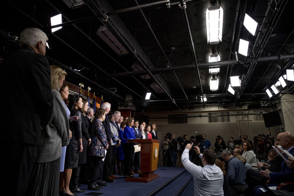 House Speaker Nancy Pelosi of Calif., accompanied by House Congress members, speaks at a news conference to discuss the United States Mexico Canada Agreement (USMCA) trade agreement, Tuesday, Dec. 10, 2019, on Capitol Hill in Washington. (AP Photo/Andrew Harnik)