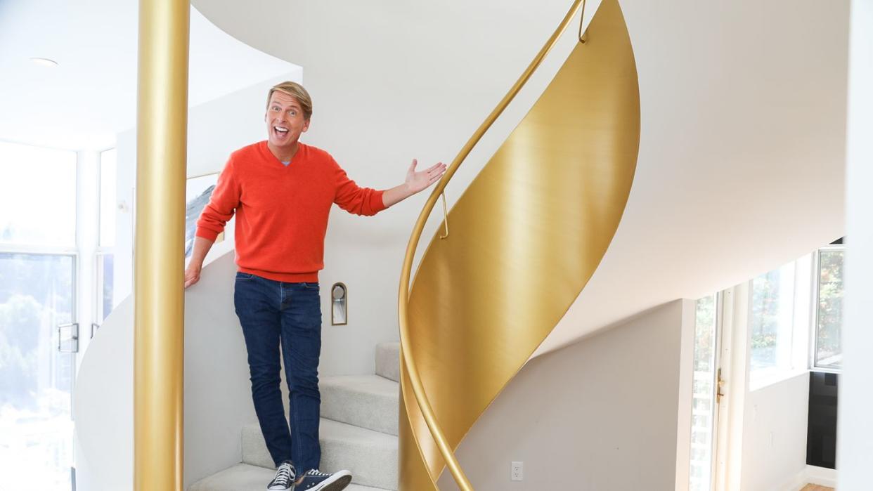 host jack mcbrayer taking in the sights of the golden sax house, as seen on zillow gone wild, season 1