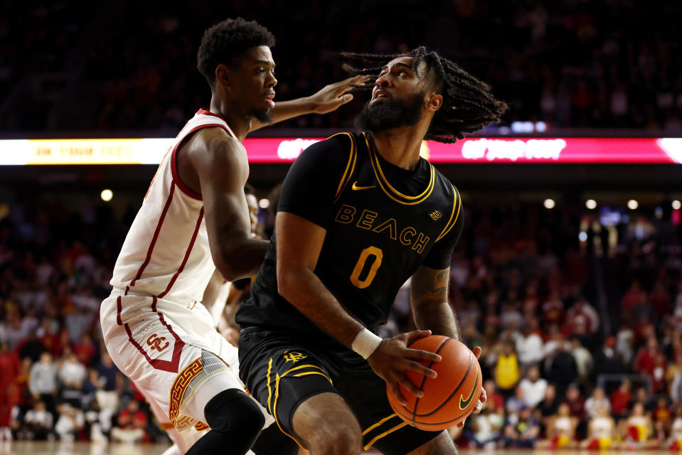 LOS ANGELES, CALIFORNIA - DECEMBER 10: Marcus Tsohonis #0 of the Long Beach State 49ers fights for position against Joshua Morgan #24 of the USC Trojans during the second half at Galen Center on  the USC Trojans December 10, 2023 in Los Angeles, California. (Photo by Katelyn Mulcahy/Getty Images)