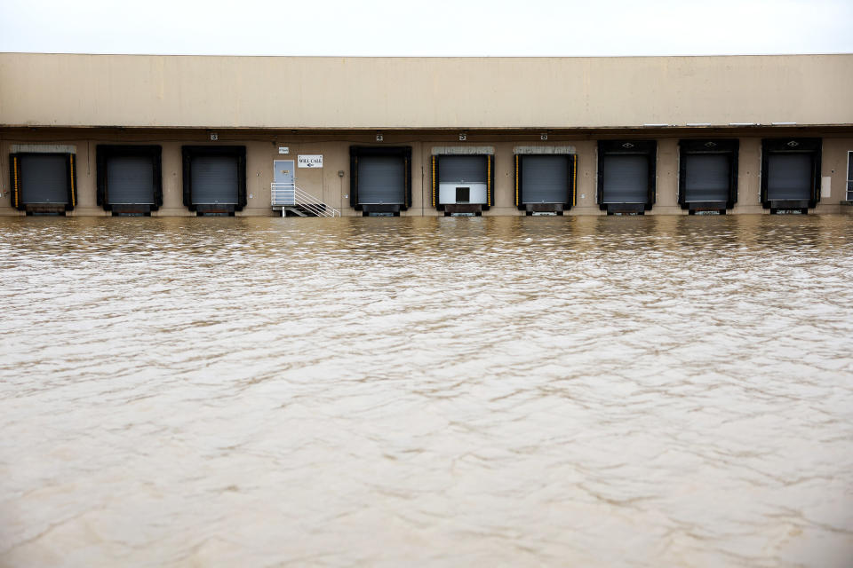 Floodwaters fill a parking lot in front of loading docks in Pajaro, California, on March 14, 2023.