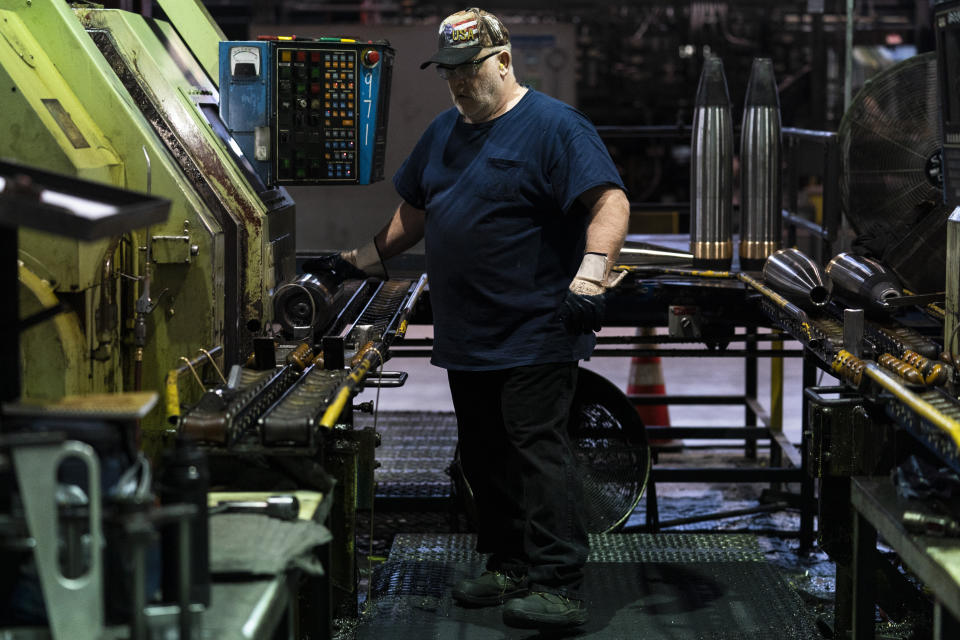 A steel worker operates a machine used in the manufacturing of 155 mm M795 artillery projectiles at the Scranton Army Ammunition Plant in Scranton, Pa., Thursday, April 13, 2023. One of the most important munitions of the Ukraine war comes from a historic factory in this city built by coal barons, where tons of steel rods are brought in by train to be forged into the artillery shells Kyiv can’t get enough of — and that the U.S. can’t produce fast enough. (AP Photo/Matt Rourke)