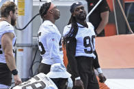 Cleveland Browns defensive linemen Jadeveon Clowney, right, talks with defensive linemen Myles Garrett during an NFL football practice at the team training facility, Tuesday, June 15, 2021 in Berea, Ohio. (AP Photo/David Dermer)