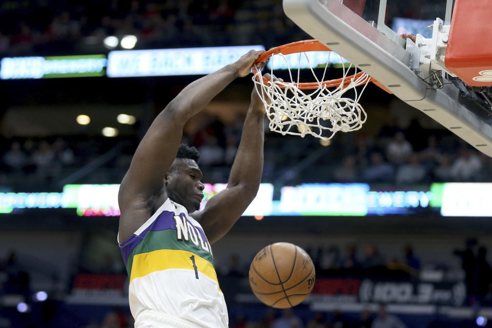 New Orleans Pelicans forward Zion Williamson (1) dunks the ball against the Portland Trail Blazers in the first half of an NBA basketball game in New Orleans, Tuesday, Feb. 11, 2020. (AP Photo/Rusty Costanza)