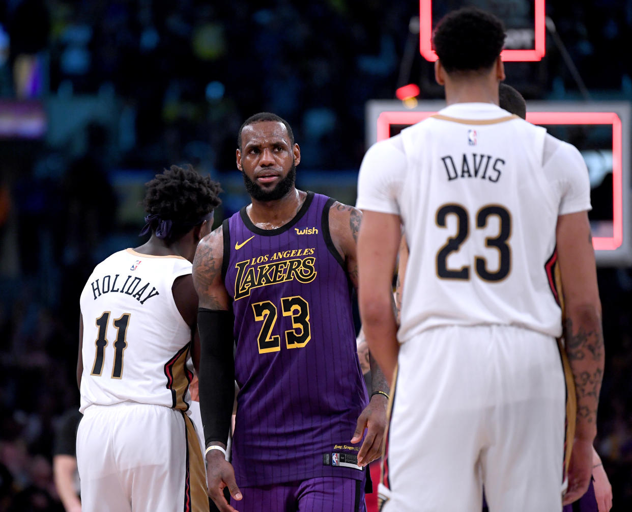 LOS ANGELES, CALIFORNIA - DECEMBER 21:  LeBron James #23 of the Los Angeles Lakers reacts in front of Anthony Davis #23 of the New Orleans Pelicans after a 112-104 Laker win at Staples Center on December 21, 2018 in Los Angeles, California.  NOTE TO USER: User expressly acknowledges and agrees that, by downloading and or using this photograph, User is consenting to the terms and conditions of the Getty Images License Agreement. (Photo by Harry How/Getty Images)