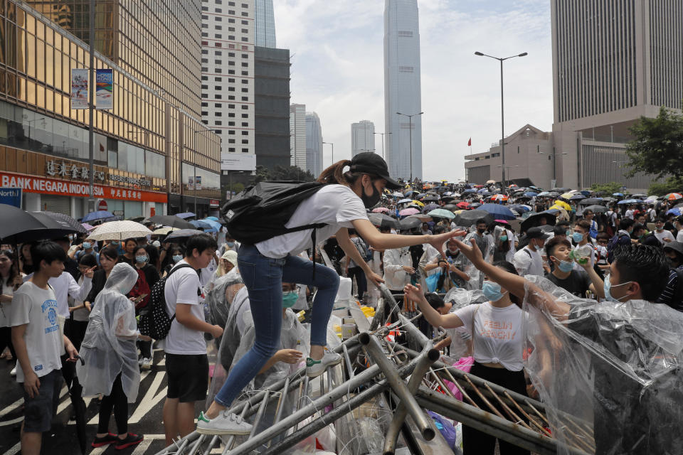 Protestors gather near the Legislative Council in Hong Kong, Wednesday, June 12, 2019. Thousands of protesters blocked entry to Hong Kong's government headquarters Wednesday, delaying a legislative session on a proposed extradition bill that has heightened fears over greater Chinese control and erosion of civil liberties in the semiautonomous territory. (AP Photo/Kin Cheung)
