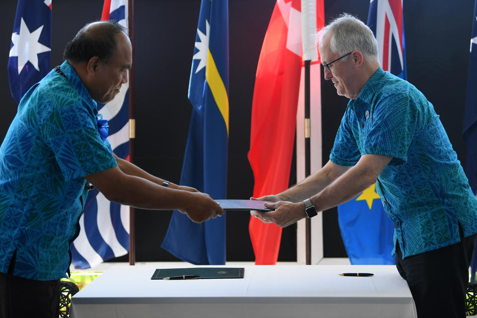 Former Australian Prime Minister Malcolm Turnbull (right) and Kiribati President Taneti Maamau after signing a Memorandum of Understanding in 2017. Source: AAP