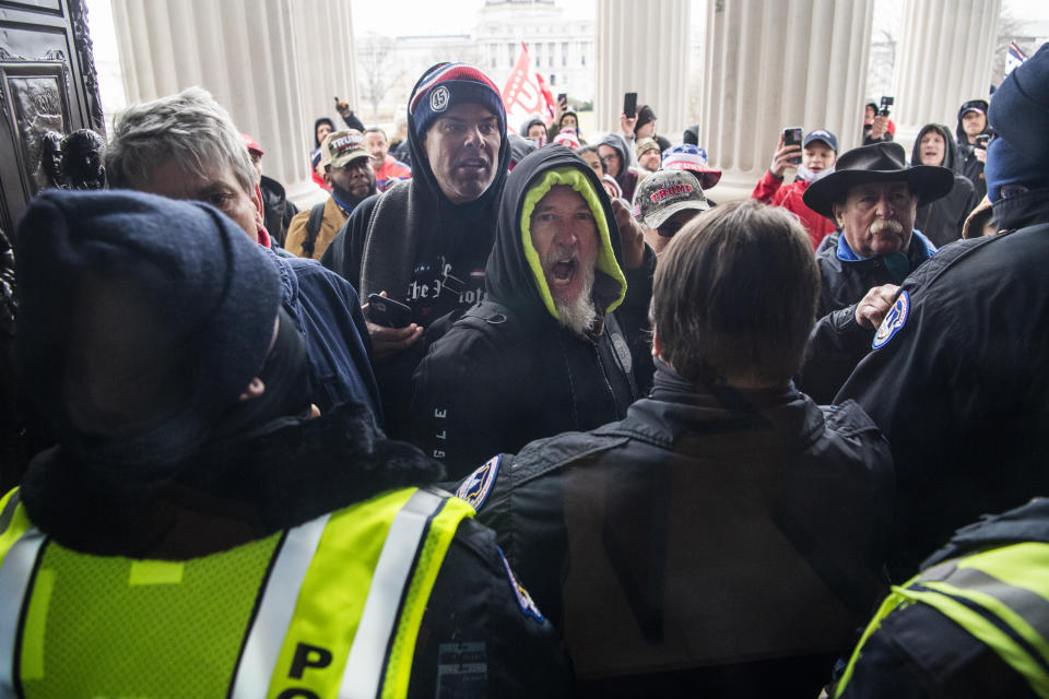 Rioters attempt to enter the Capitol at the House steps during a joint session of Congress to certify the Electoral College vote on Wednesday, January 6, 2021. (Tom Williams/CQ Roll Call via Getty Images)