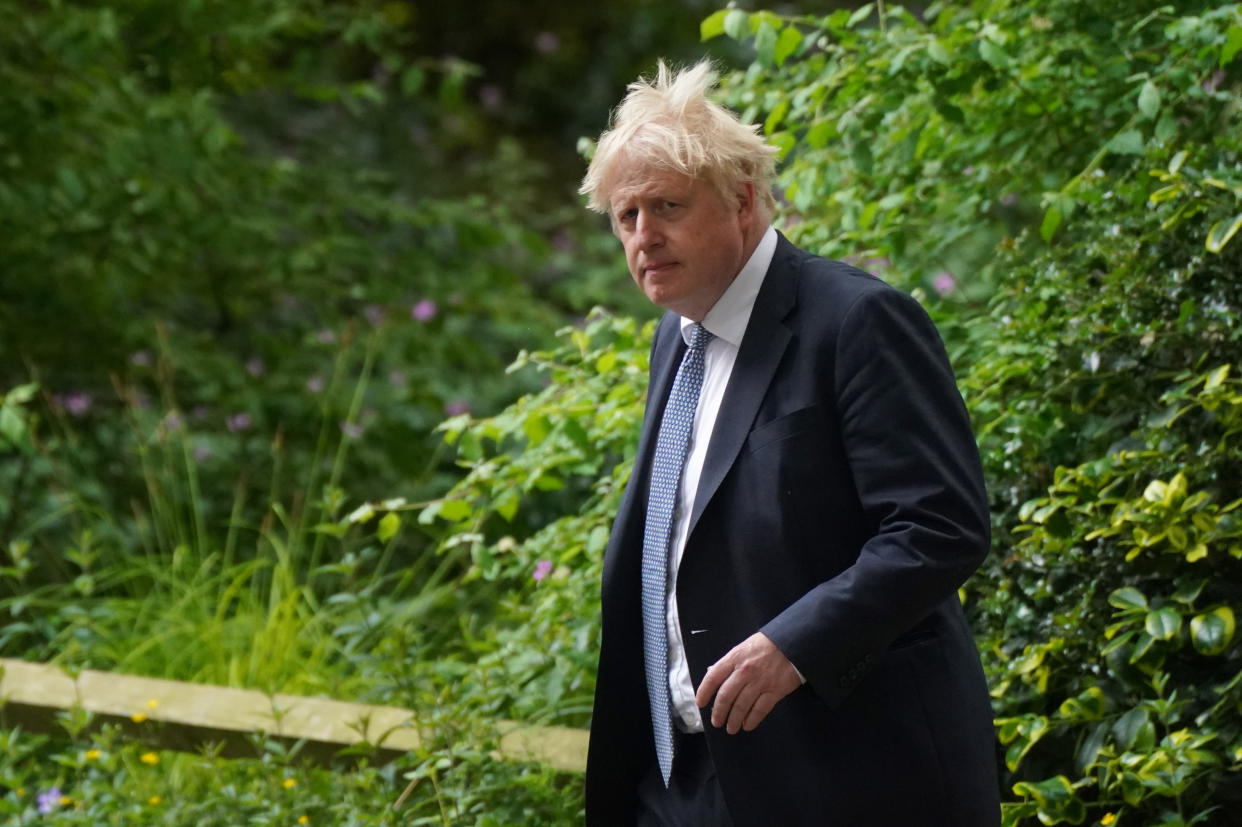 Prime Minister Boris Johnson walks down Downing Street in London after a press conference following the publication of the Sue Gray report into parties in Whitehall during the coronavirus lockdown. Picture date: Wednesday May 25, 2022.