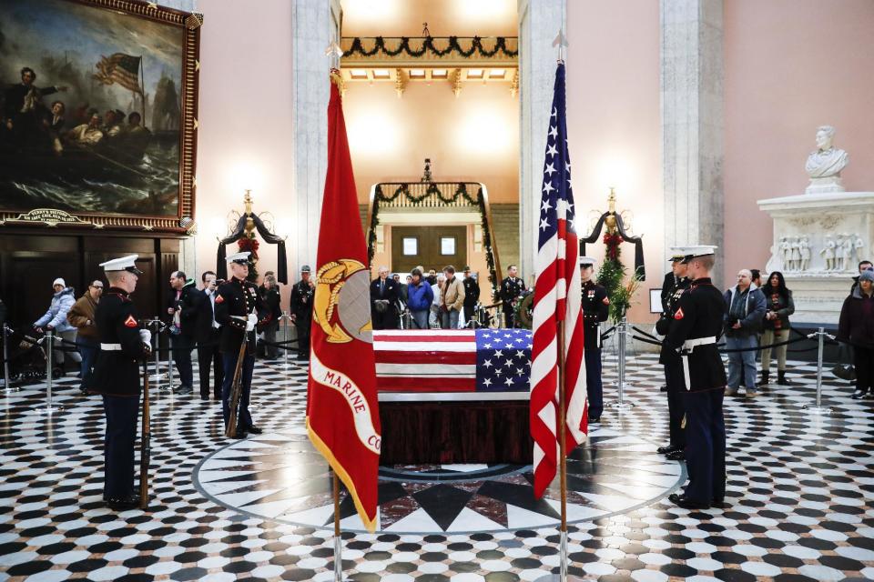 Marines stand guard at the casket of John Glenn, Friday, Dec. 16, 2016, in Columbus, Ohio. Glenn's home state and the nation began saying goodbye to the famed astronaut who died last week at the age of 95. (AP Photo/John Minchillo)