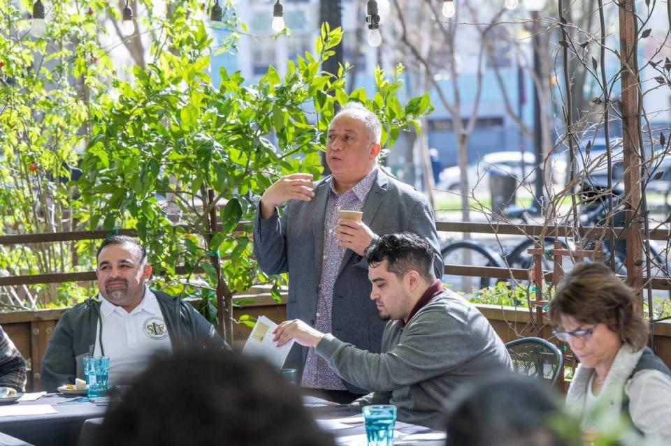 Ernesto Delgado leads a meeting of local business owners and leaders on March 16 at his restaurant La Cosecha at Cesar Chavez Plaza. Delgado has been holding meetings to with the goal of improving the park and making it an inviting place for the whole community.