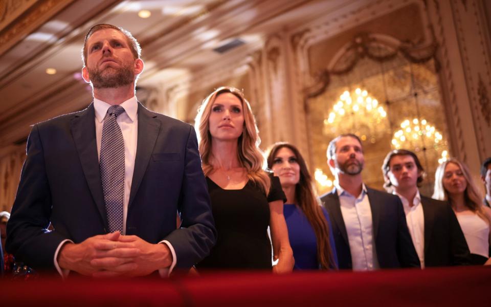 Donald Trump's children and their partners listen as the Republican frontrunner delivers his Super Tuesday victory speech