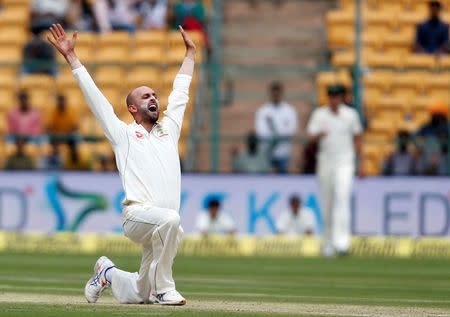 Australia's Nathan Lyon celebrates the wicket of India's captain Virat Kohli. REUTERS/Danish Siddiqui