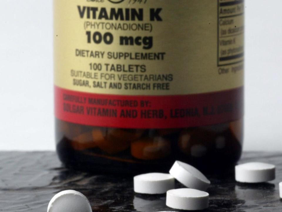 vitamin k supplement pills and bottle