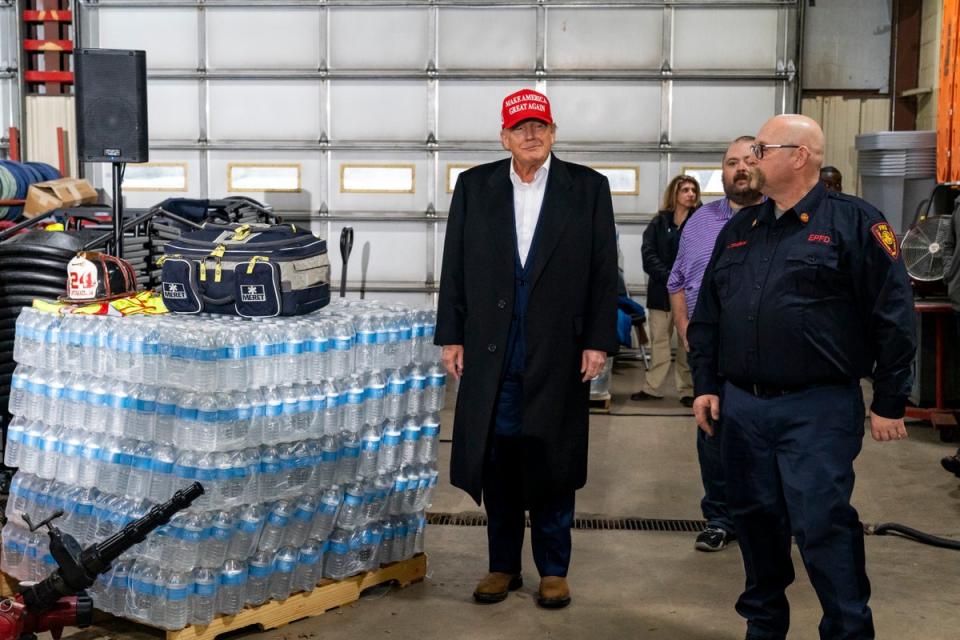 Former President Donald Trump stands next to a pallet of water before delivering remarks at the East Palestine Fire Department station (Getty Images)