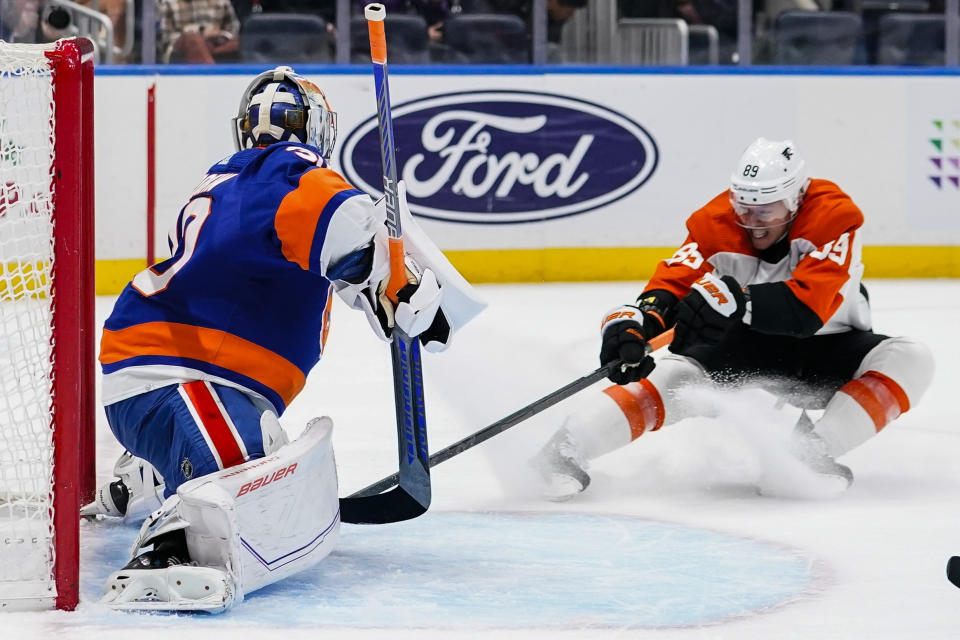 New York Islanders goaltender Ilya Sorokin (30) defends against Philadelphia Flyers' Cam Atkinson (89) during the first period of an NHL hockey game Wednesday, Nov. 22, 2023, in Elmont, N.Y. (AP Photo/Frank Franklin II)