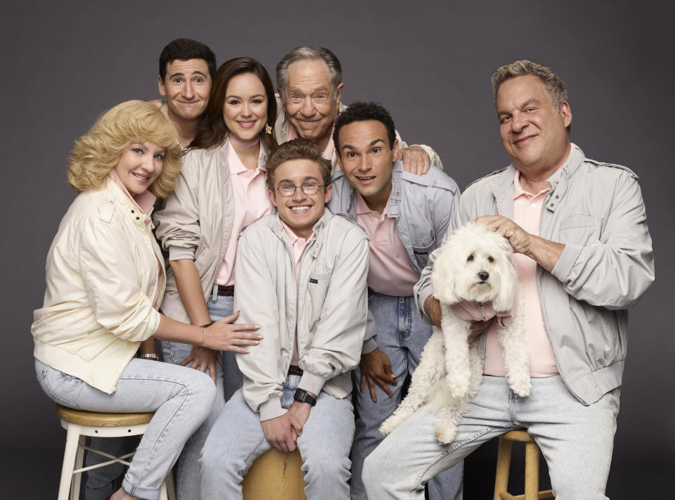 This image released by ABC shows the cast of the comedy series "The Goldbergs," clockwise from left, Wendi McLendon-Covey, Sam Lerner, Hayley Orrantia, George Segal, Troy Gentile, Jeff Garlin and Sean Giambrone. Segal, the banjo player turned actor who was nominated for an Oscar for 1966's “Who’s Afraid of Virginia Woolf?,” and starred in the ABC sitcom “The Goldbergs,” died Tuesday, his wife said. He was 87.(Andrew Eccles/ABC via AP)