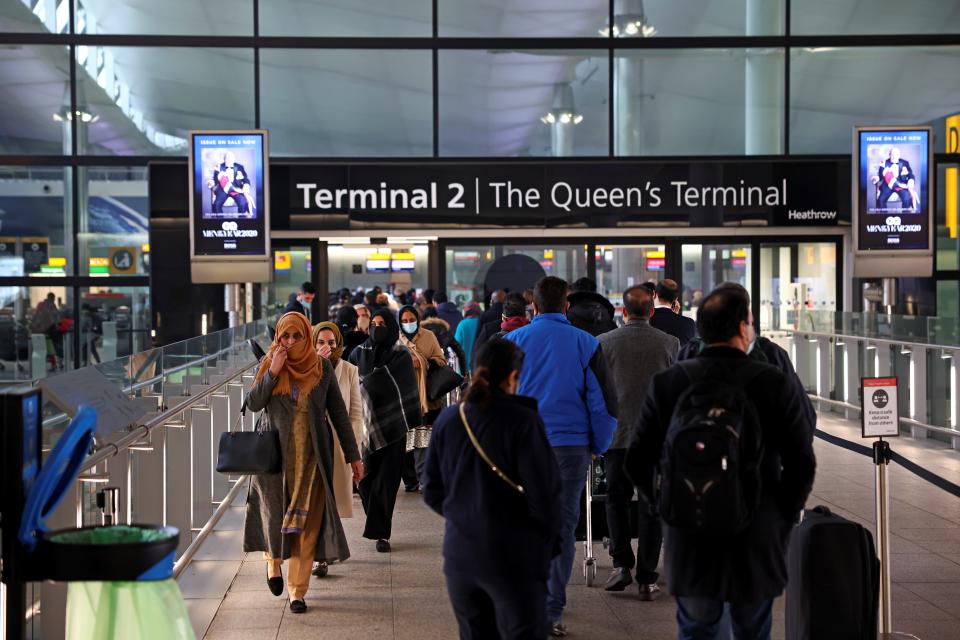 <p>People queue to enter Terminal 2 at Heathrow</p> (REUTERS)