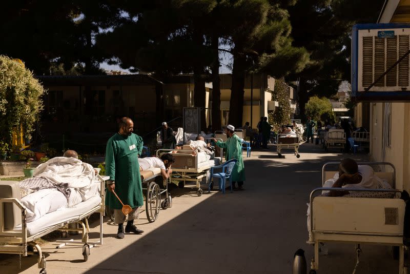 Patients sunbathe at the Red Cross rehabilitation center in Kabul